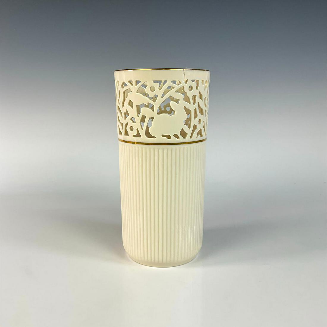 Vintage Lenox Openwork Vase, Forest Animals: Ivory white cylindrical vase with fluted body texture; open work rim displaying rabbit, squirrel, deer, and flowers. Gold gilt band and rim. Lenox backstamp. Dimensions: 7.75"H x 4"Dia. Manufacturer: