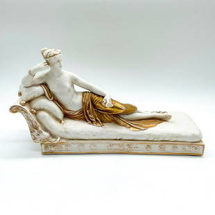 Antique Dressel, Kister and Co Statuette, Venus Victrix: White figure of Venus draped in a golden cloth, lounging on a chaise and holding an apple. Inspired by Antonio Canova (Italian 1757-1822) 1805-1808 Neoclassical sculpture of Venus. Dressel, Kister and