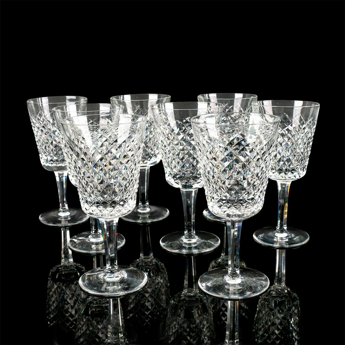 8pc Waterford Crystal Wine Glasses: Elegant clear lead crystal glasses cut in an appealing geometric design. Waterford acid etched back stamp. Issued: 20th c. Dimensions: 7"H x 3.25"Dia. Manufacturer: Waterford Country of Origin: Irelan