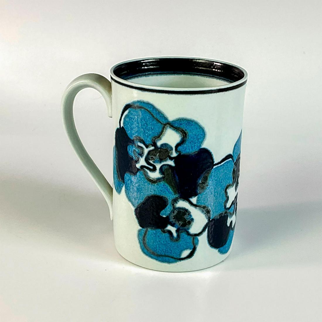Royal Copenhagen Earthenware Mug for Madison Avenue: Light and dark blue abstract flowers on a white ground. Dark blue interior trim. Fall 1927 commemorative gift of the opening of Royal Copenhagen's new Madison Avenue shop. Certificate of Authenticity