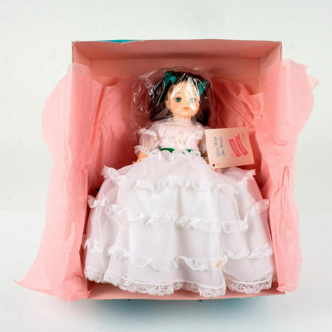 Vintage Madame Alexander Doll, Gone with the Wind: Scarlett Oâ€™Hara in a white lace dress with a emerald-green ribbon. Madame Alexander tag. This item has its original box: 15in x 12.25in x 6". Stand not included. Dimensions: 5"L x 13"W x 14"H M