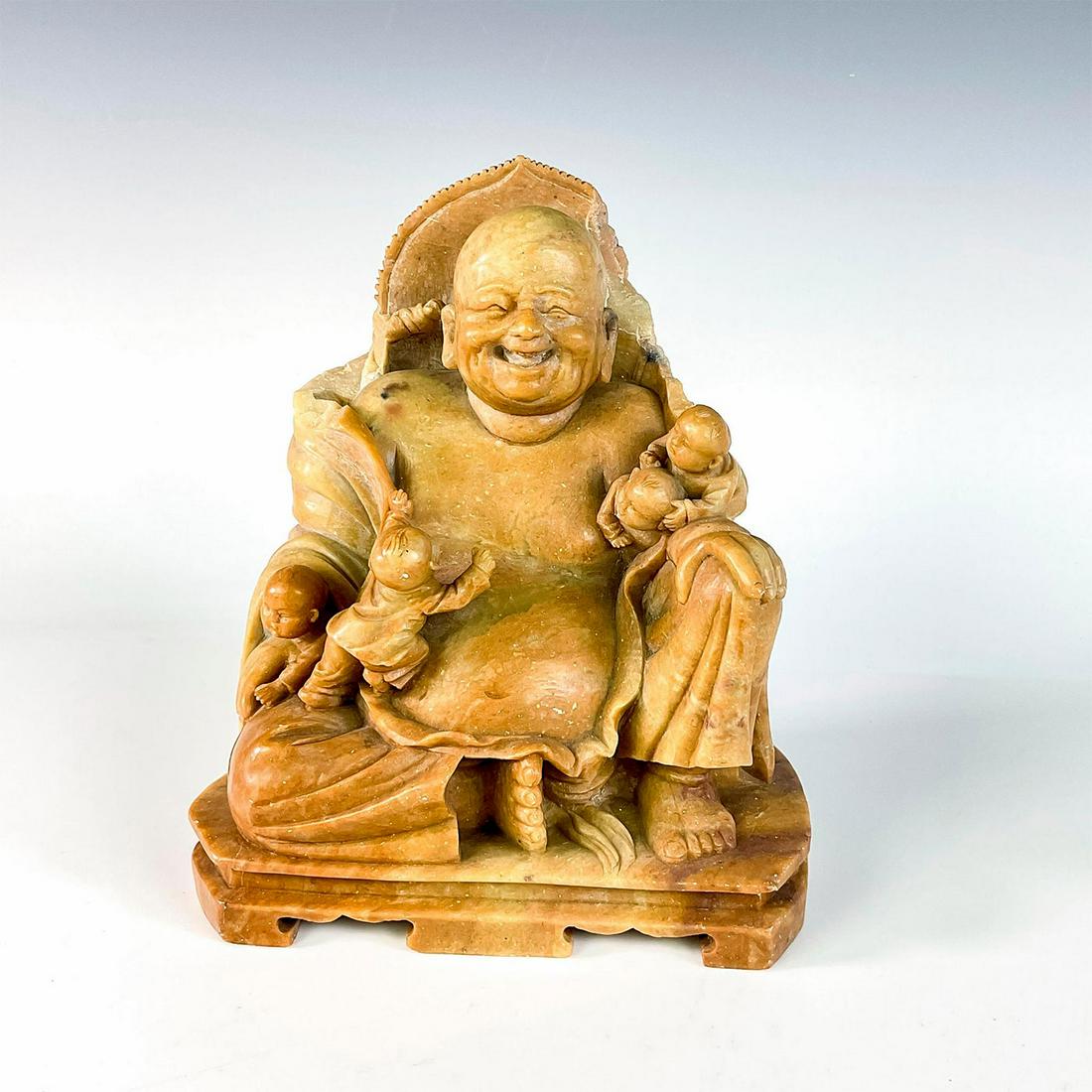 Carved Soapstone Laughing Buddha with Children: Lovely laughing Buddha with children climbing and playing around him. Issued: Mid 1900â€™s Dimensions: 7"L x 5"W x 7.5"H