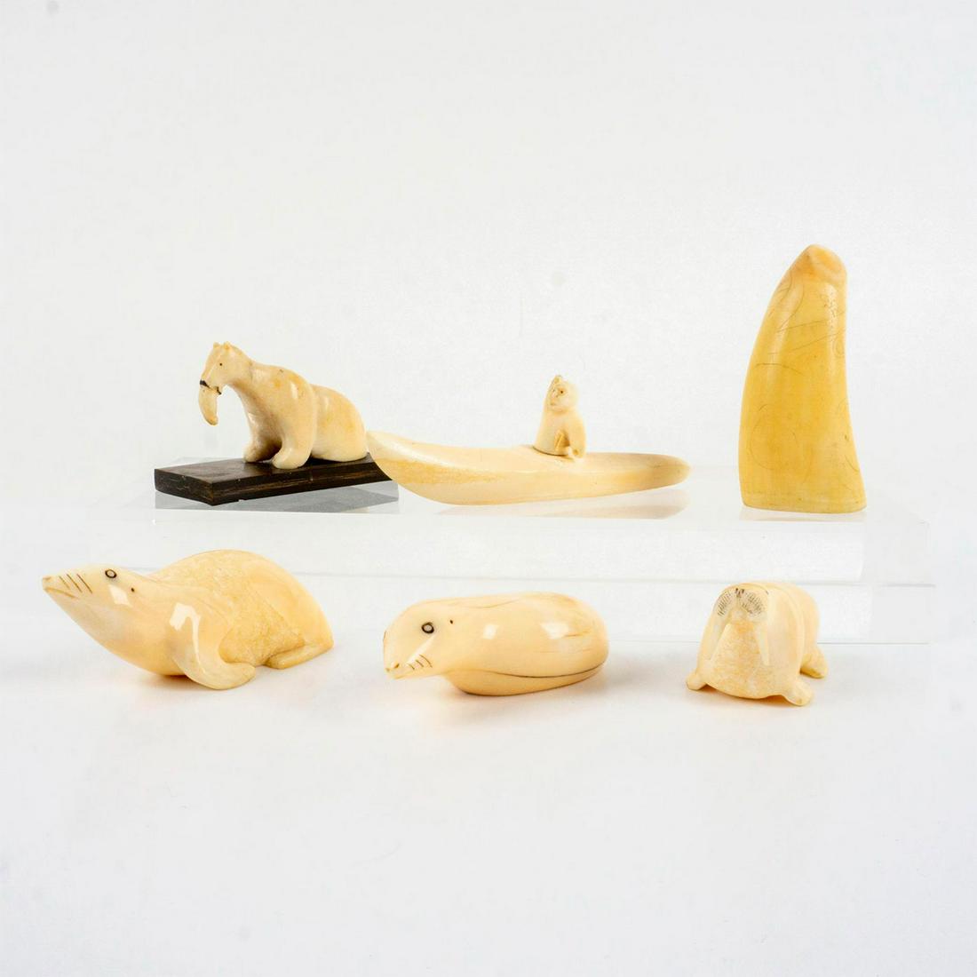 6pc Alaska Inuit Figurines for Dodge Test Run, 1949: Hand carved and polished white tooth figurines. Includes seals, walrus, polar bear, kayaker, and scrimshaw tooth. Four figurines have Dodge Alaska Test Run 1949 marked to bases. Polar bear is unmarked