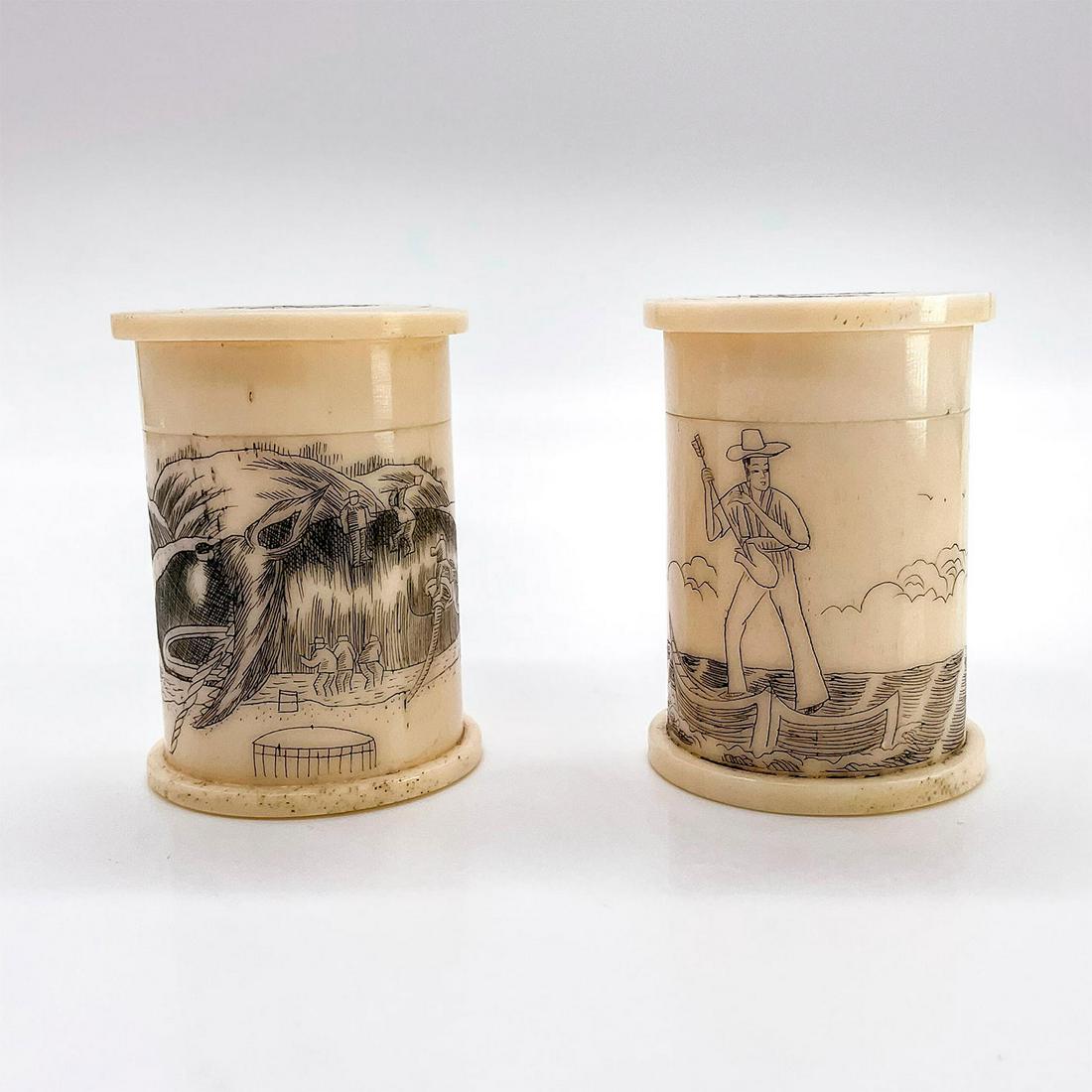 2pc Antique Mini Scrimshaw Trinket Boxes: Carved round lidded boxes with a nautical scene and hunting scene. Dimensions: 1.5"W x 2"H