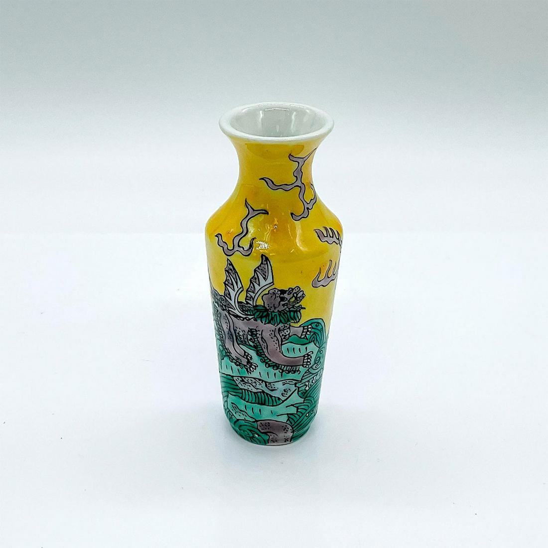 Vintage Chinese Miniature Porcelain Vase: Small vessel depicting a longma, the Chinese mythical horse with dragon scales and wings, chasing a female longma across a rushing river. Dimensions: 1.75"W x 4"H Country of Origin: China