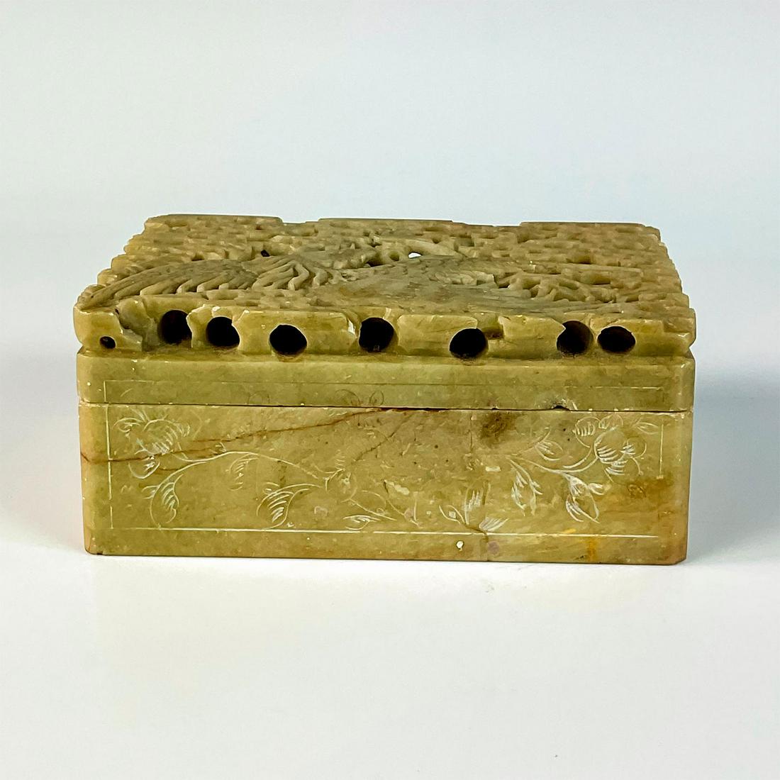 Chinese Carved Soapstone Box with Lid, Rooster: Intricately carved green soapstone box with red veins. Lid is carved as a rooster encompassed by cloud-like details. Incised floral decorations to sides. Dimensions: 4.75"L x 3.5"W x 2"H Country of Or