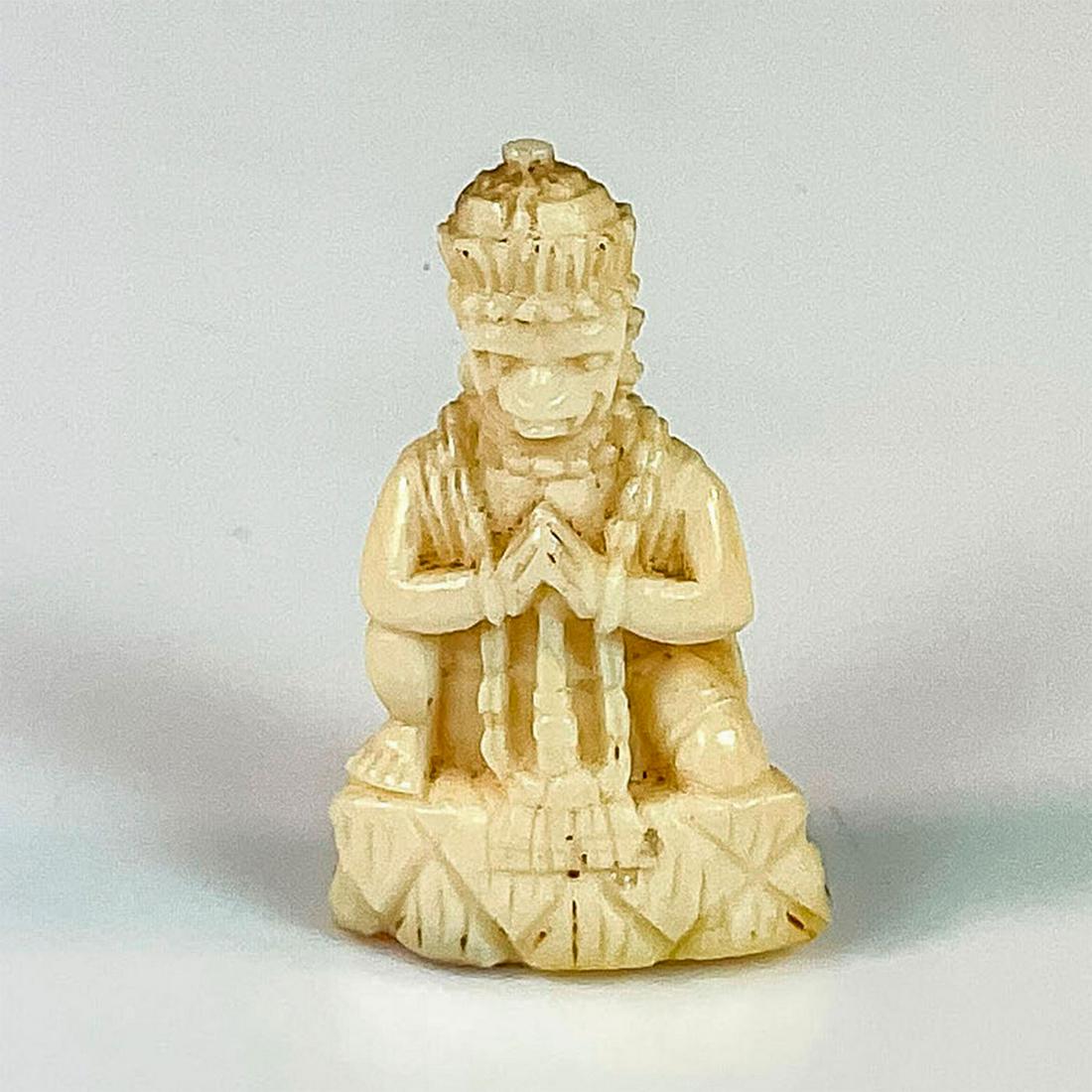 Chinese Tiny Carved Bone Monkey King Figurine: A beautiful hand carved figure of Sun Wukong with his palms pressed together, mimicking or perhaps mocking the Buddha. Dimensions: 0.75"L x 0.5"W x 1.5"H Country of Origin: China