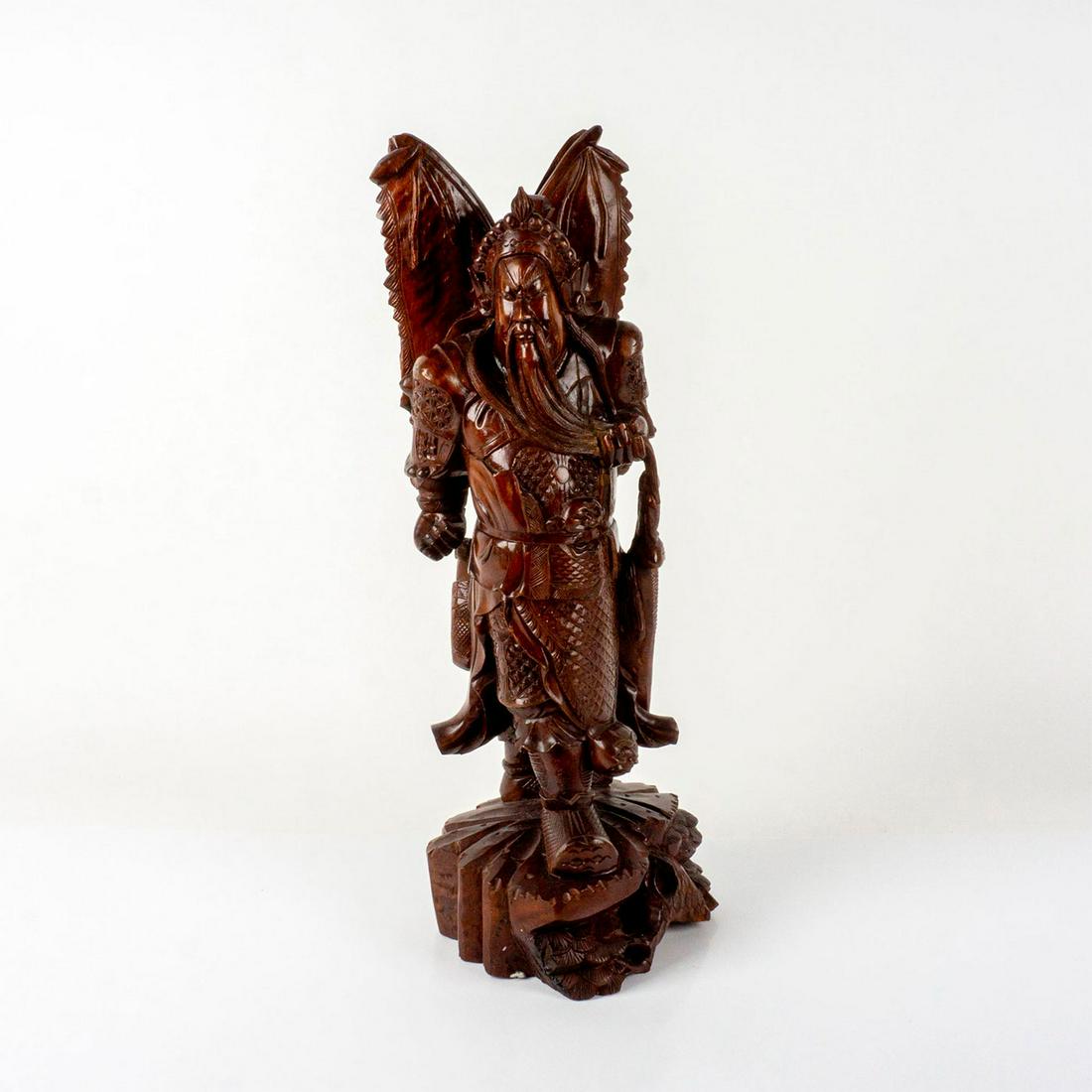 Vintage Rosewood Carved Statue of Guan Gong: A beautiful carving of the Chinese warrior guardian, the God of Wealth; decorated with intricate details on his armor. Dimensions: 8.25"L x 7"W x 21.75"H