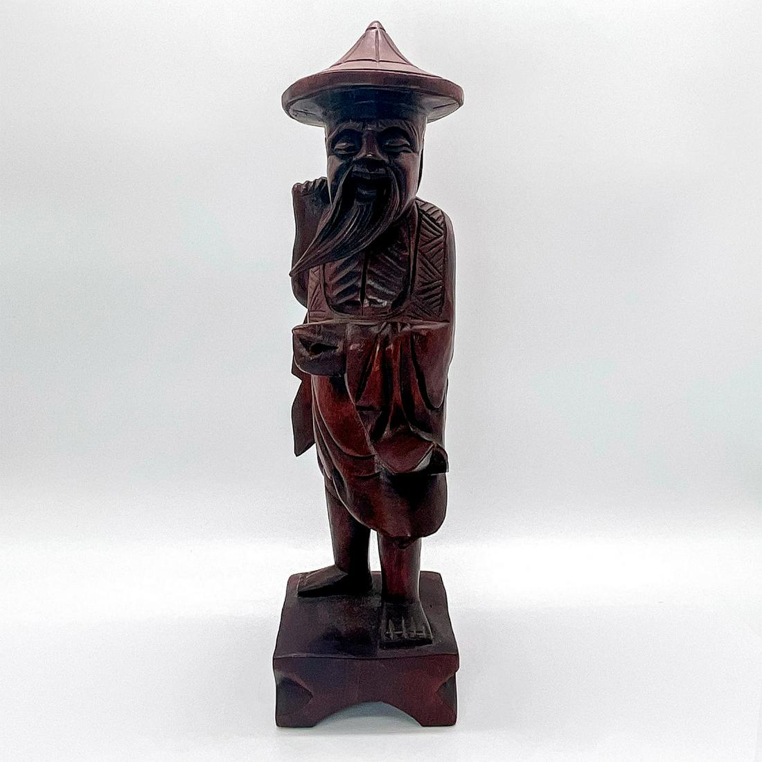 Chinese Wood Carved Old Fisherman With Long Beard and Hat: Hand carved in wood and finished in deep reddish mahogany color. Simplistic, primitive style with detailed robe and face. Dimensions: 3.25"L x 3.25"W x 12"H