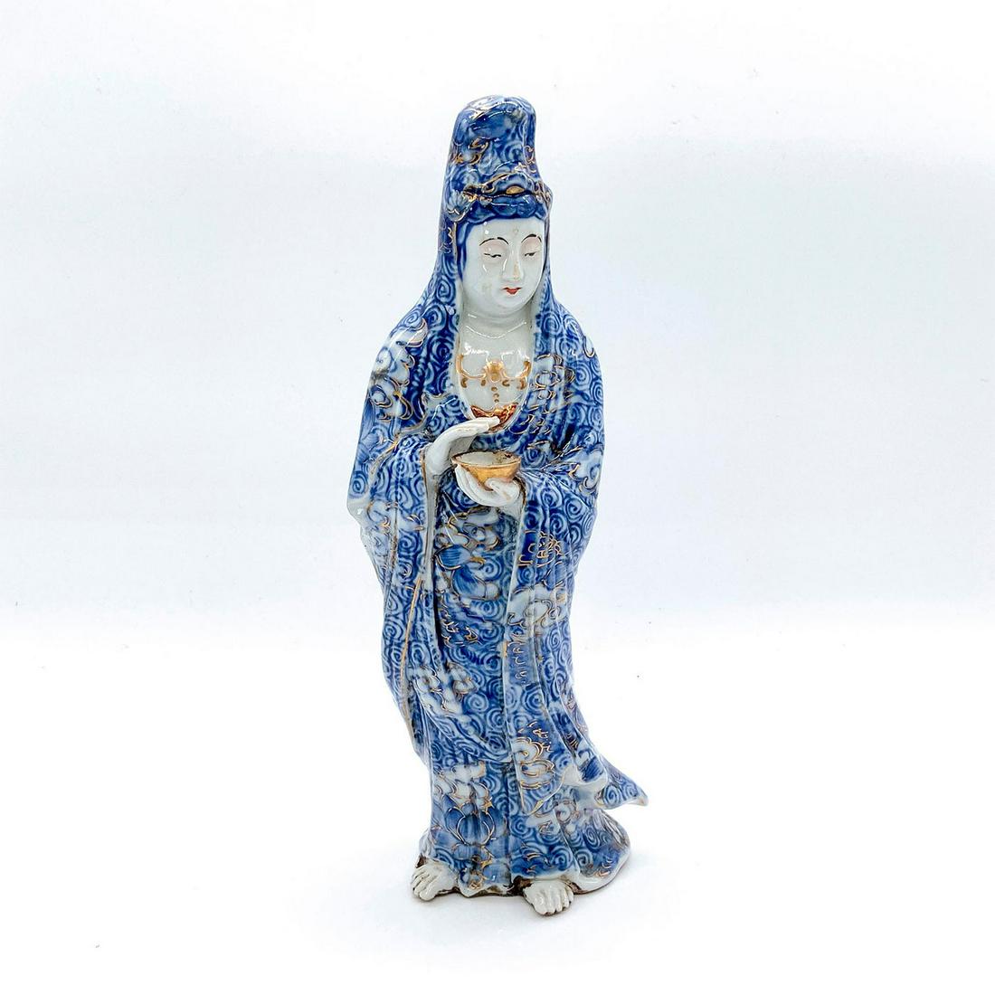 Chinese Ceramic Figurine, Lung Nue: ï¿½Dragon Girlï¿½. Depicts follower of Buddhist bodhisattva Guanyin. She holds a bowl in her hand representing the Pearl of Light. Beautifully decorated wearing blue flowing robes in blue with g
