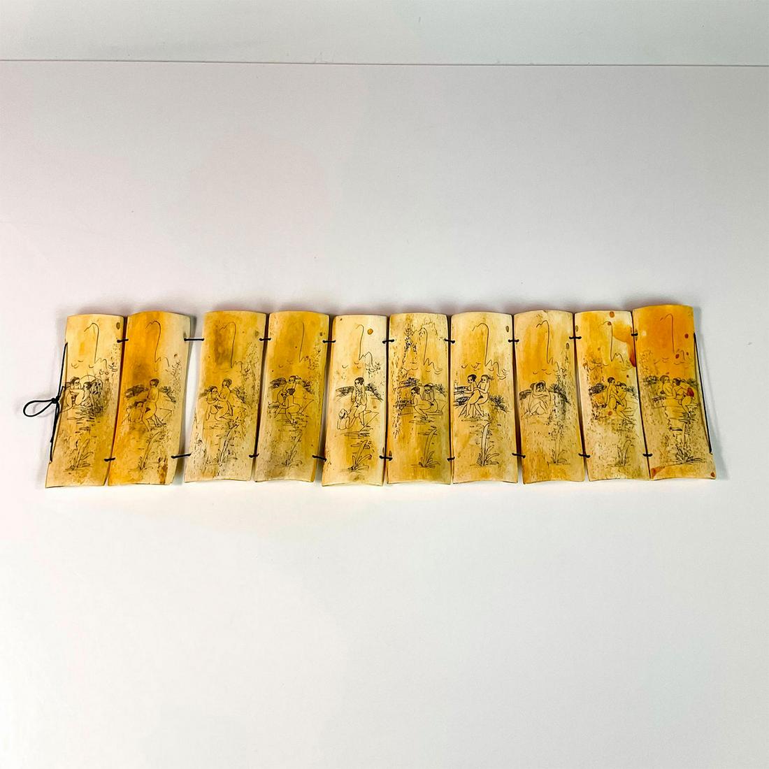 Antique Japanese Scrimshaw Erotic Bone Panels: 10 bone panels carved with erotic scenes; drilled holes and strung together as a set. Dimensions: 16.25"L x 0.5"W x 4.75"H Country of Origin: Japan
