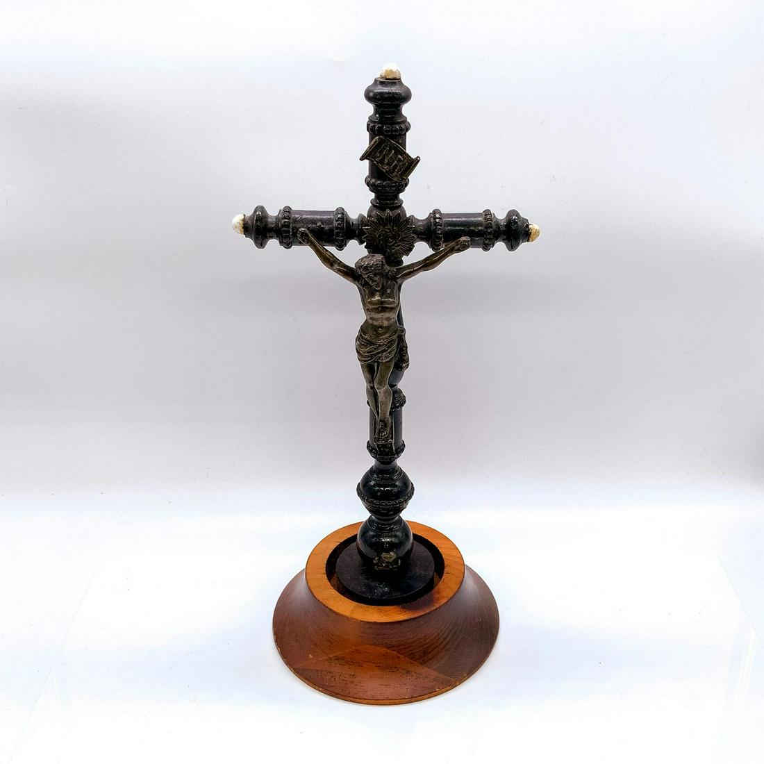 Wood and Metal Standing Crucifix: Depicts Jesus Christ in metal upon a wooden cross. â€˜INRIâ€™ metal banner attached to top. Cross detaches from base. Dimensions: 6.5"L x 6"W x 14"H