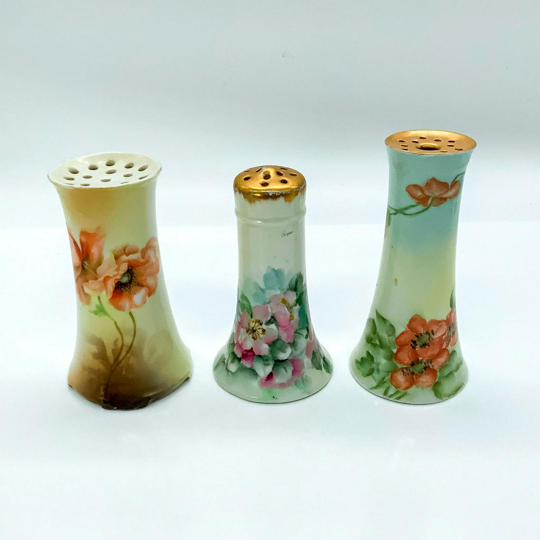 3pc Vintage European Hat Pin Holders: Glossy finish. Beautifully decorated with unique floral designs. Two with golden tops. RS, O & EG, and J&C G.H.B.Co backstamps. Dimension of tallest holder: 2 in. D x 5 in. H. Country of Origin: Germa