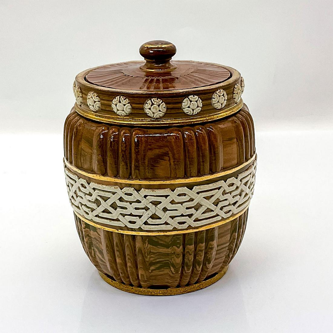 Doulton Lambeth Agate Ware Tobacco Jar: Made using various colors of clay laid upon each other and then kneaded together, creating the marble effect. with white flowers and lattice and gold band design in relief. Impressed Doulton Lambeth. 