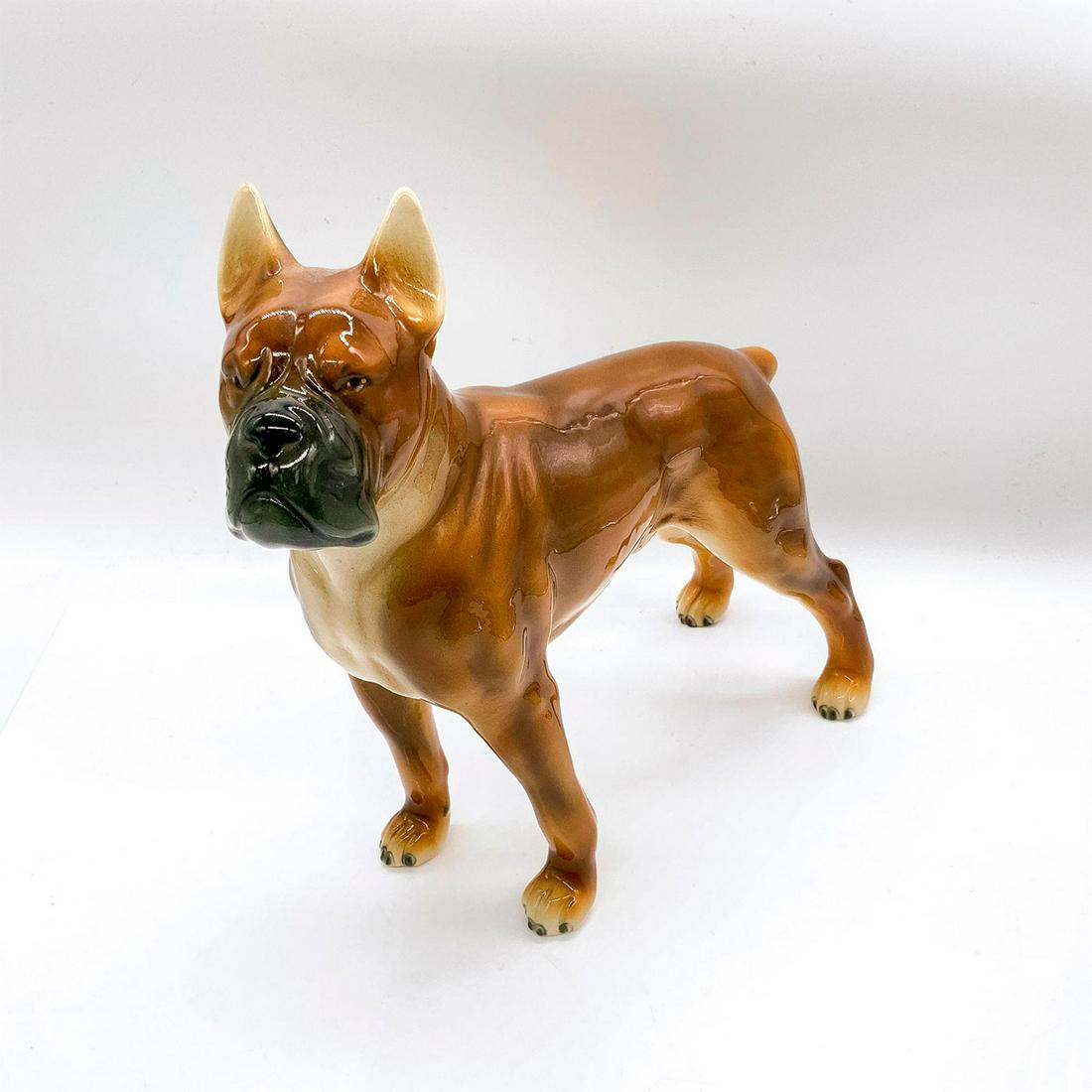 Gloriette Keramik Animal Figurine, Boxer Dog: Depicted in brown, tan, and black coloration. In standing and attentive pose. Gloriette Keramik backstamp. Dimensions: 10.75"L x 4"W x 9.75"H Manufacturer: Gloriette Keramik Country of Origin: Austria