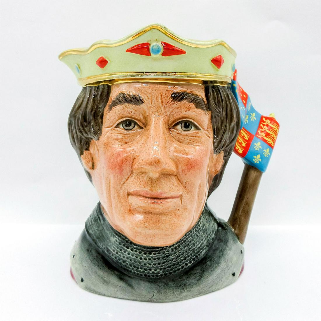 Henry V D6671 - Large - Royal Doulton Character Jug: Embossed yellow crown with gold, turquoise, and red design and flag handle. Age related wear seen as faded gilt paint. Royal Doulton backstamp. Box 10"H x 7"L x 6"W. King Henry V (1387-1422) renewed t