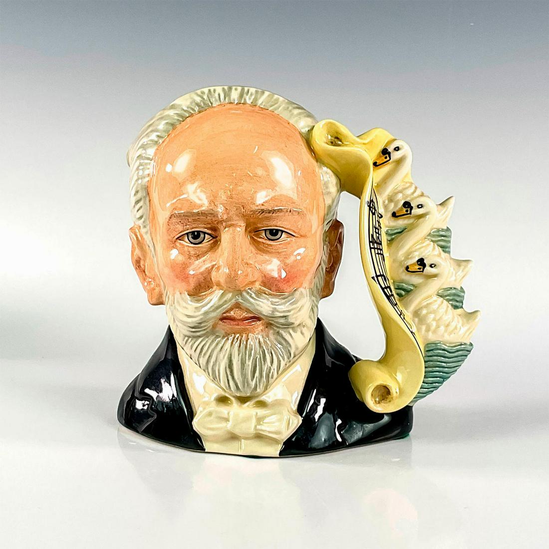 Tchaikovsky D7022 - Large - Royal Doulton Character Jug: Black, grey and white coloration. Series: Great Composers. Royal Doulton backstamp. Artist: Stanley J. Taylor Issued: 1996 - 2001 Dimensions: 7"H Manufacturer: Royal Doulton Country of Origin:
