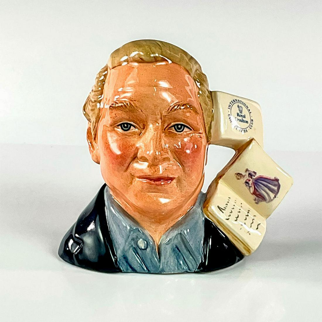 Figure Collector D7156 - Small - Royal Doulton Character Jug: Dark blue jacket; light blue shirt. Series: RDICC. Royal Doulton backstamp. Artist: Robert Tabbenor Issued: 2001 - 2001 Dimensions: 4.75"H Manufacturer: Royal Doulton Country of Origin: Englan