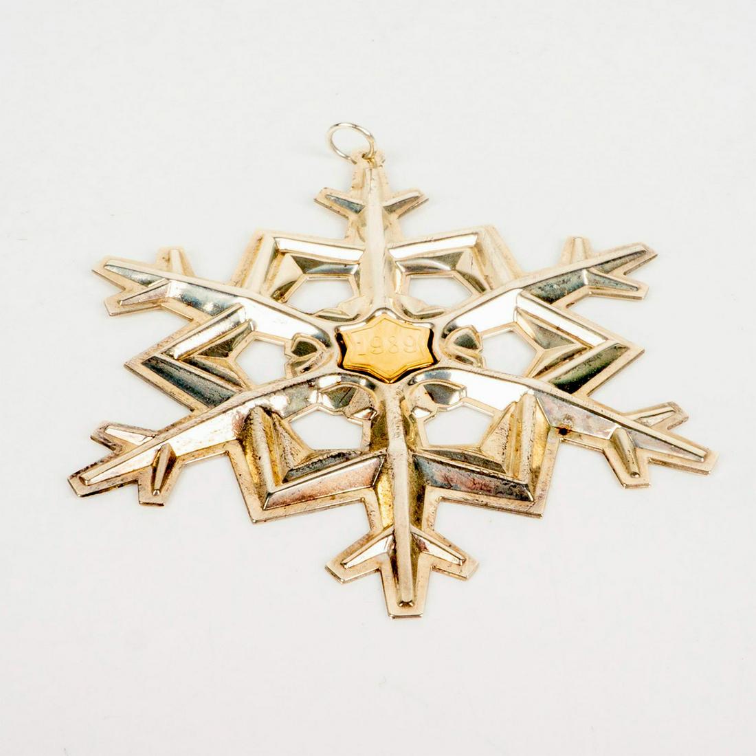 Gorham Sterling Silver 1989 Christmas Ornament, Snowflake: Gold filled year mark. Gorham 925 sterling silver. Weight 18 grams. Comes with original pouch. Dimensions: 3"W x 3.5"H High