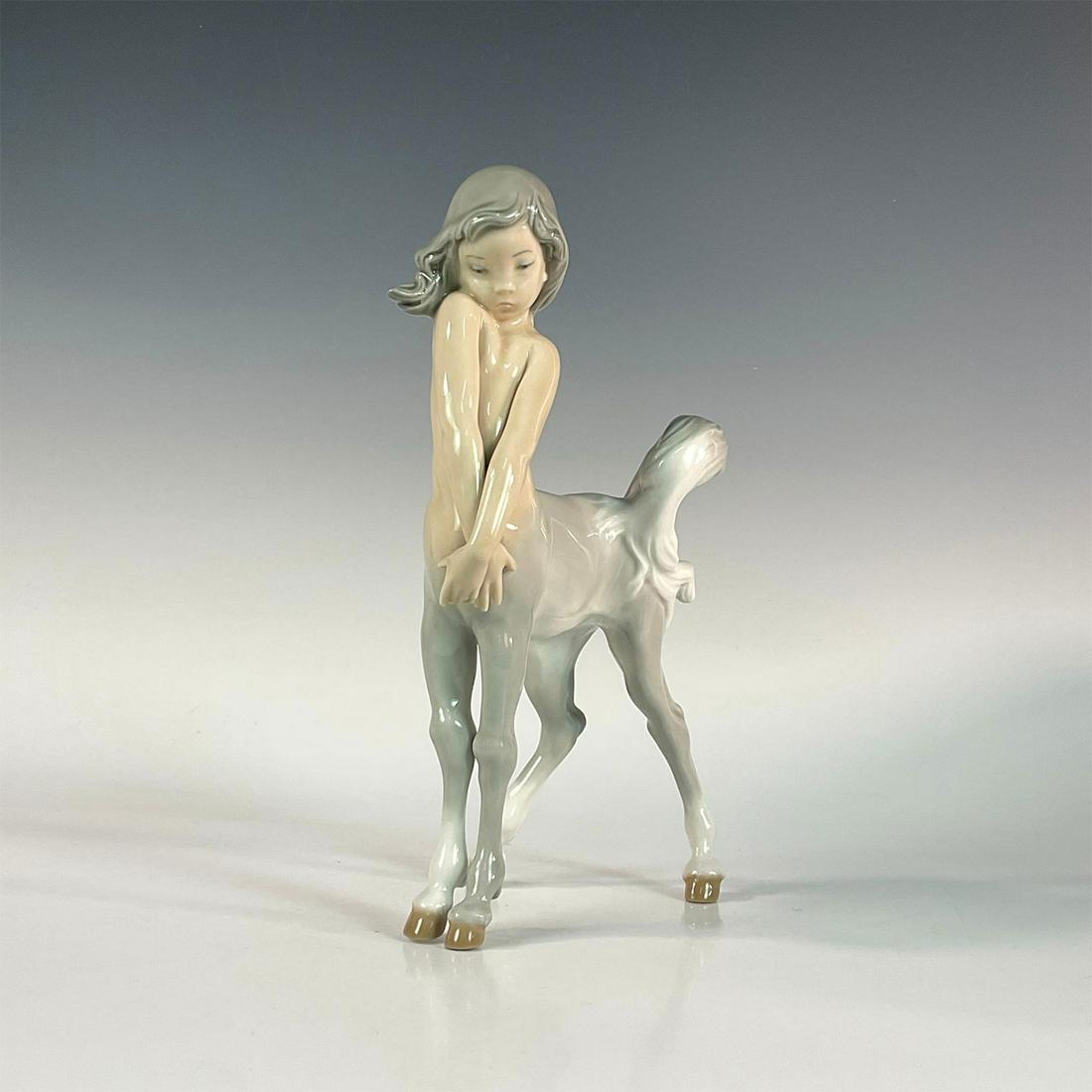 Centaur Girl 1001012 - Lladro Porcelain Figurine: Glossy finish; Lladro backstamp. Artist: Fulgencio Garcia Issued: 1969 - 1989 Dimensions: 9.5"H Manufacturer: Lladro Country of Origin: Spain