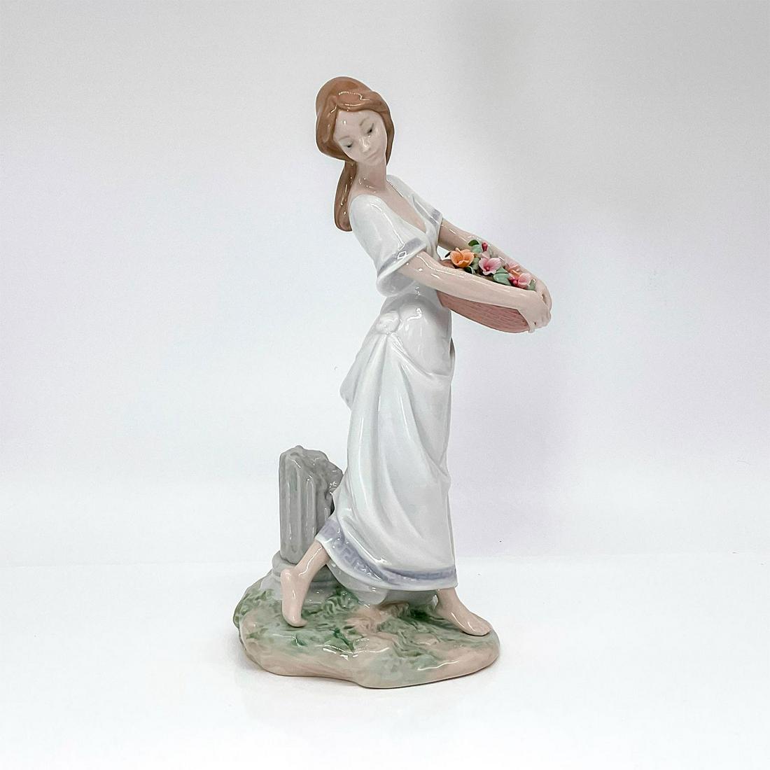 Gardens Of Athens 1007704 - Lladro Porcelain Figurine: Glossy finish; Lladro backstamp. Comes with original box with dimensions of 12.25 in. L x 10.25 in. W x 7 in. H. Artist: Joan Coderch Issued: 2004 - 2006 Dimensions: 9.75"H x 5.5"W Manufacturer: Lladr
