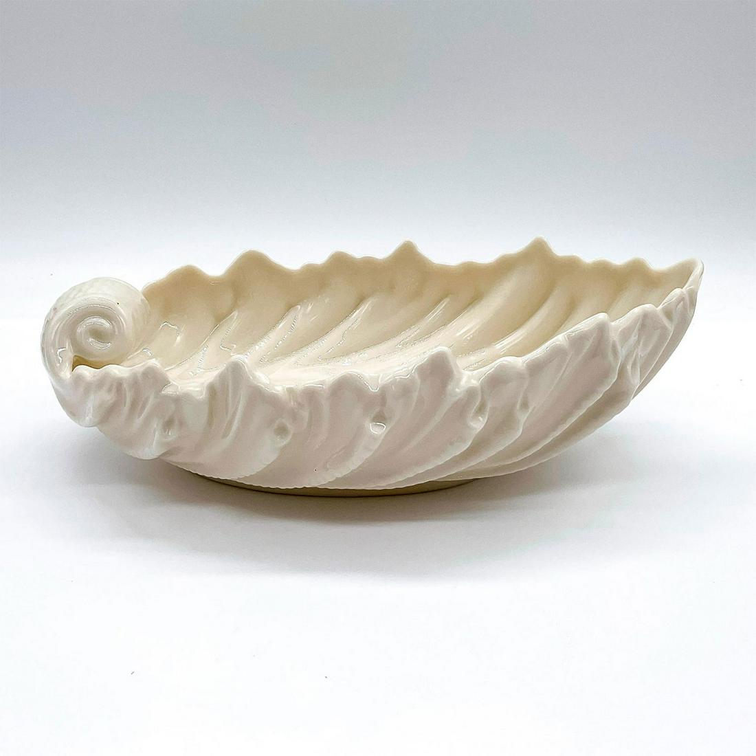 Vintage Lenox Porcelain Acanthus Leaf Bowl: A glazed cream-color bowl molded as a large leaf. Lenox backstamp. Dimensions: 9.25"L x 5.75"W x 3"H Manufacturer: Lenox Country of Origin: United States