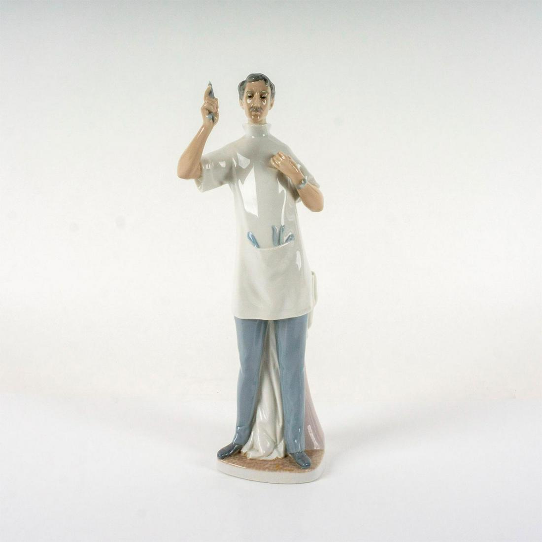 Dentist 1004762 - Lladro Porcelain Figurine: Glossy finish porcelain depicting a dentist in uniform holding a tooth with forceps. Lladro backstamp. Artist: Salvador Furio Issued: 1971-1978 Dimensions: 4.5"L x 3.75"W x 14"H Manufacturer: Lladro