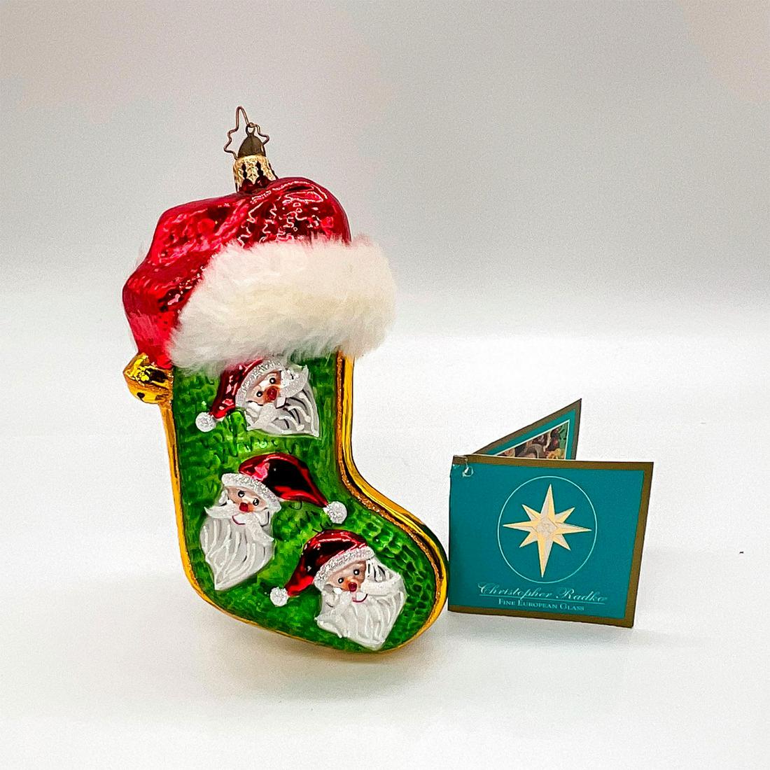 Nick N Fuzzy - Christopher Radko Christmas Ornament: Colorful, mouth blown, and handcrafted glass stocking with fluffy trim. Gold ornament attached atop piece and hang tag on stocking ornament. Issued: 2005 Dimensions: 4"L x 2"W x 7"H Manufacturer: Chri