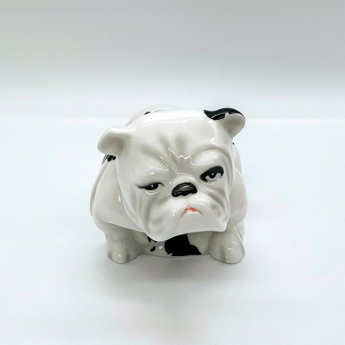 Royal Doulton Bulldog Figure, Patch DD002: Glossy finish. Depicts seated dog in white and black coloration. Royal Doulton backstamp. Bone china. Issued: 2012 Dimensions: 6"L x 3.25"W x 3.75"H Manufacturer: Royal Doulton