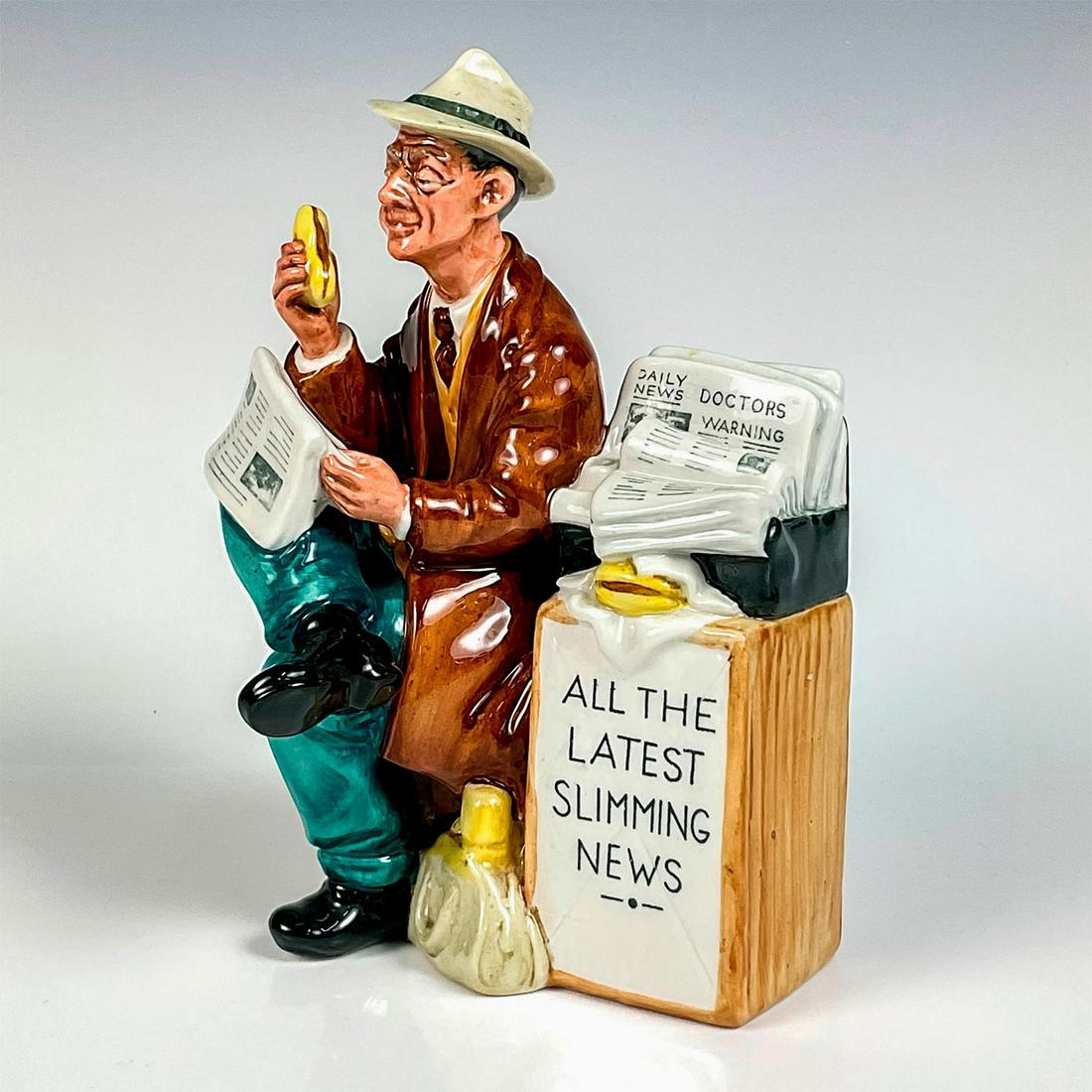 Stop Press HN2683 - Royal Doulton Figurine: Artist: Mary Nicoll Issued: 1977 - 1981 Dimensions: 7.5"H Manufacturer: Royal Doulton Country of Origin: England