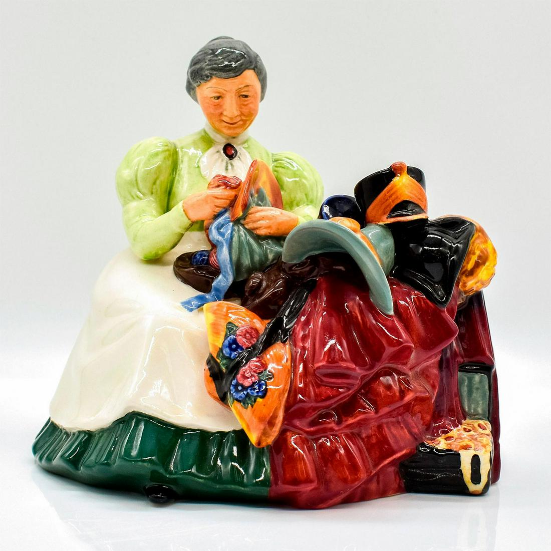Wardrobe Mistress HN2145 - Royal Doulton Figurine: She makes sure all the costumes are in tip top shape. Series: Professions. Royal Doulton backstamp. Artist: Peggy Davies Issued: 1954 - 1967 Dimensions: 5.75"H Manufacturer: Royal Doulton Country