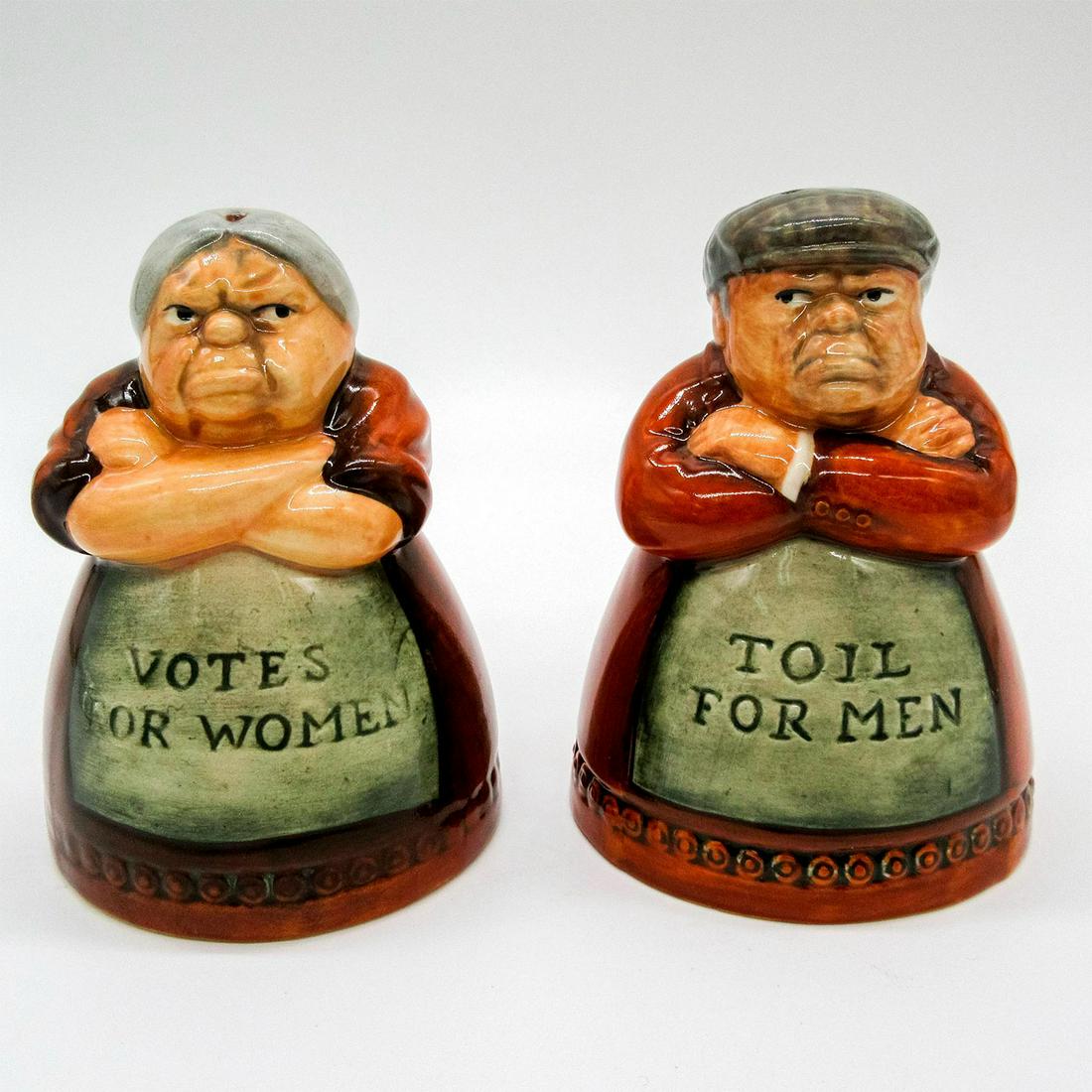 Royal Doulton Salt and Pepper Shakers, Suffragette: Includes the suffragette, D7066, and her husband, D7067. "Votes for Women" on the pepper shaker, and "Toill for Men" on the salt shaker. Royal Doulton backstamp. #RoyalDoulton #SaltPepperShakers #Suff