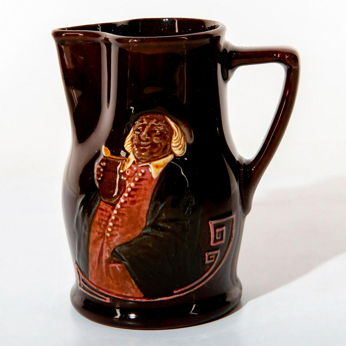 Royal Doulton Kingsware Jug, Hogarth: Dark brown glaze with features man in relief. Inscription on back reads Drink Wisely. Royal Doulton backstamp. Weight: 7 oz #drinkwisely Issued: 20th c. Dimensions: 4.5"H Manufacturer: Royal Doulton C
