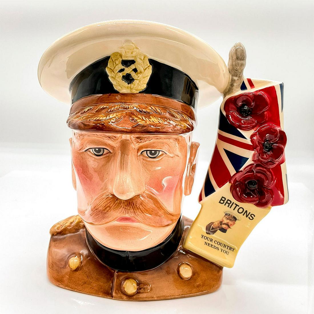 Lord Kitchener D7148 - Large - Royal Doulton Character Jug: Khaki uniform with black collar, white and brown cap. Lord Horatio Kitchener was renowned for his war efforts. This model was issued to commemorate the 150th anniversary of Lord Kitchener's death. Iss