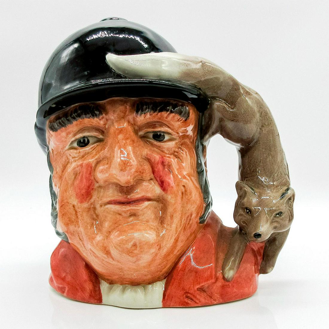 Gone Away D6531 - Large - Royal Doulton Character Jug: Red jacket, black cap. This very British huntsman looks ready to give the traditional call signaling the loss of the quarry. His prey, the fox, has won this round! Artist: Garry Sharpe Issued: 1960 - 