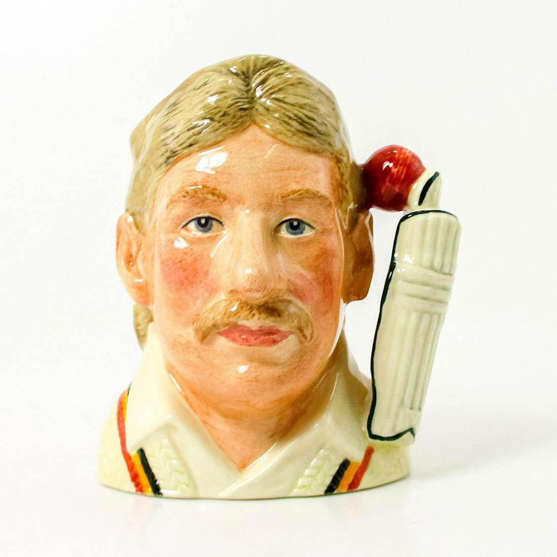 Ian Botham D7091 - Small - Royal Doulton Character Jug: White sweater with red, yellow and navy stripes. Series: Cricketers. Royal Doulton backstamp. Comes with Certificate of Authenticity. Artist: David B. Biggs Issued: 1998 Dimensions: 4.5"H Edition Numb