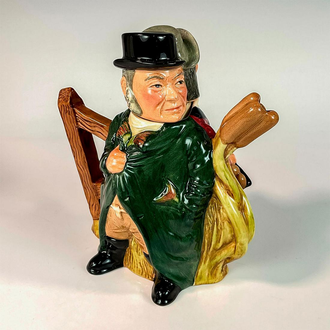 Gamekeepre/Poacher Teapot D7175 - Royal Doulton Teapot: Gamekeeper: maroon jacket; black hat, waistcoat and boots. Poacher: green overcoat; brown trousers, black boots; grey cap. Royal Doulton backstamp. Includes original box. Box measures: 7in L x 6in W x