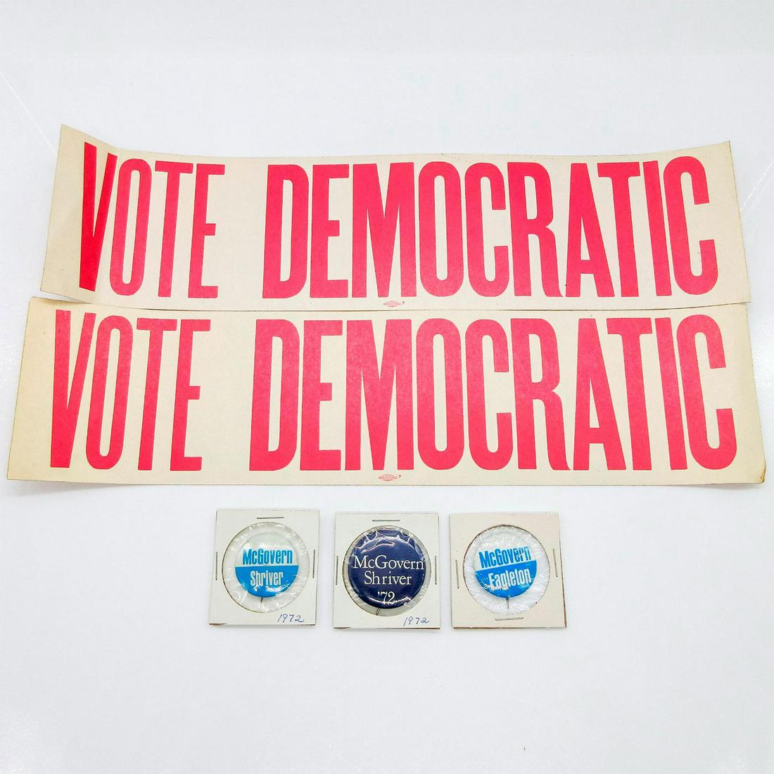 5pc Assortment of 1972 Political Campaign Buttons & Stickers: Includes: three buttons with one stating "McGovern Shriver" on front, one stating "McGovern Eagleton", and one stating "McGovern Shriver â€˜72." Two stickers state "Vot