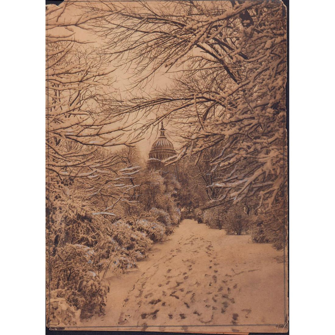 Vintage Photo of the Capitol Building in Washington, D. C.: Beautiful black and white photo of the Capitol Building in Washington D. C. covered in mantle of snow. Information of picture glued on verso. Dimensions: 7"W x 9.5"H Manufacturer: Fotographs N. Y. Cou