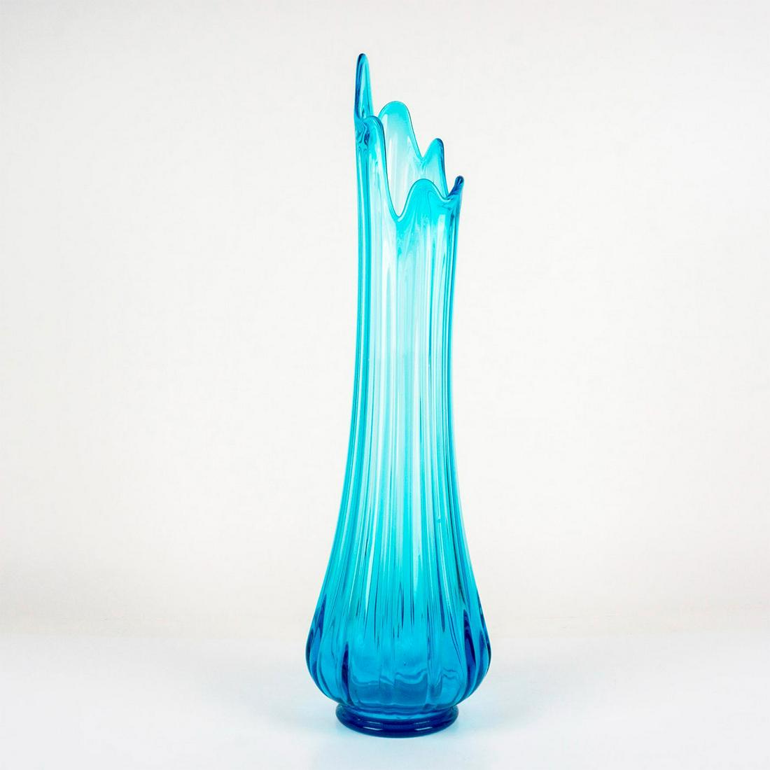 Vintage Blue Art Glass Swung Vase: A slender cerulean-blue vase with a vertical ridge pattern. Dimensions: 6.5"W x 23"H