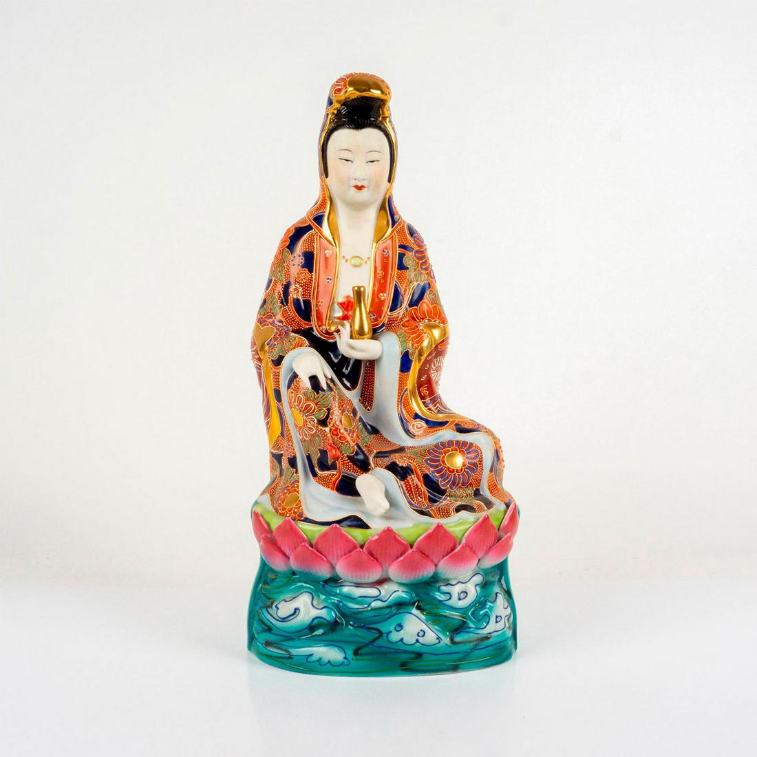 Chinese Porcelain Gilt Sculpture of the Guanyin: A beautiful painted figure of the Bodhisattva seated on a lotus. Dressed in a colorful flowing floral robe with gilded accents. Dimensions: 8.25"L x 6.5"W x 17.25"H Country of Origin: China