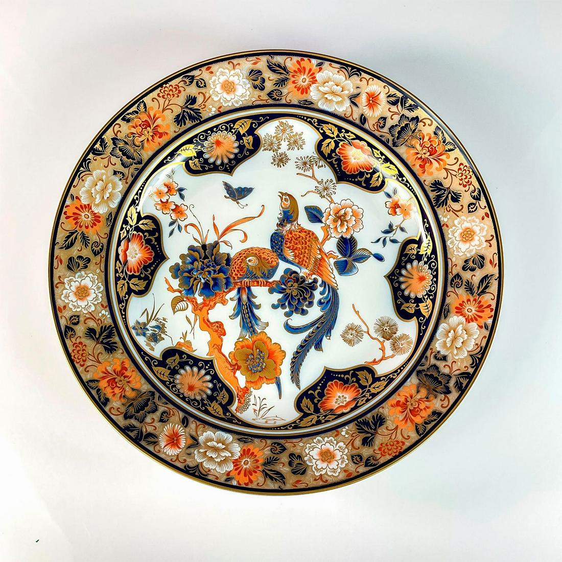 1979 Kaiser Decorative Porcelain Large Bowl, Yokohama: Multicolored with gold accents throughout. Elaborate floral and bird design. Kaiser backstamp. With back openings for hanging. Dimensions: 2.25"H x 15.25"Dia. Manufacturer: Kaiser Country of Origin: G