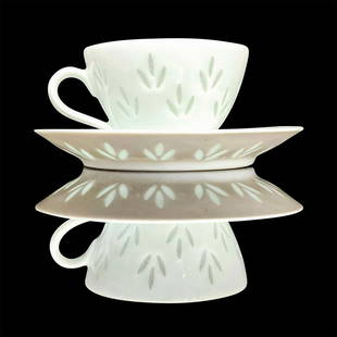 Arabia Rice Grain Leaf Demitasse Cup and Saucer: Fine white porcelain with translucent accents. Cup dimensions 3.25 in. L x 2.75 in. W x 1.75 in. H, saucer 4.5 in. D x 0.5 in. H. Artist: Friedl Holzer-Kjellberg Issued: c. 1950 - 1974 Country of Orig