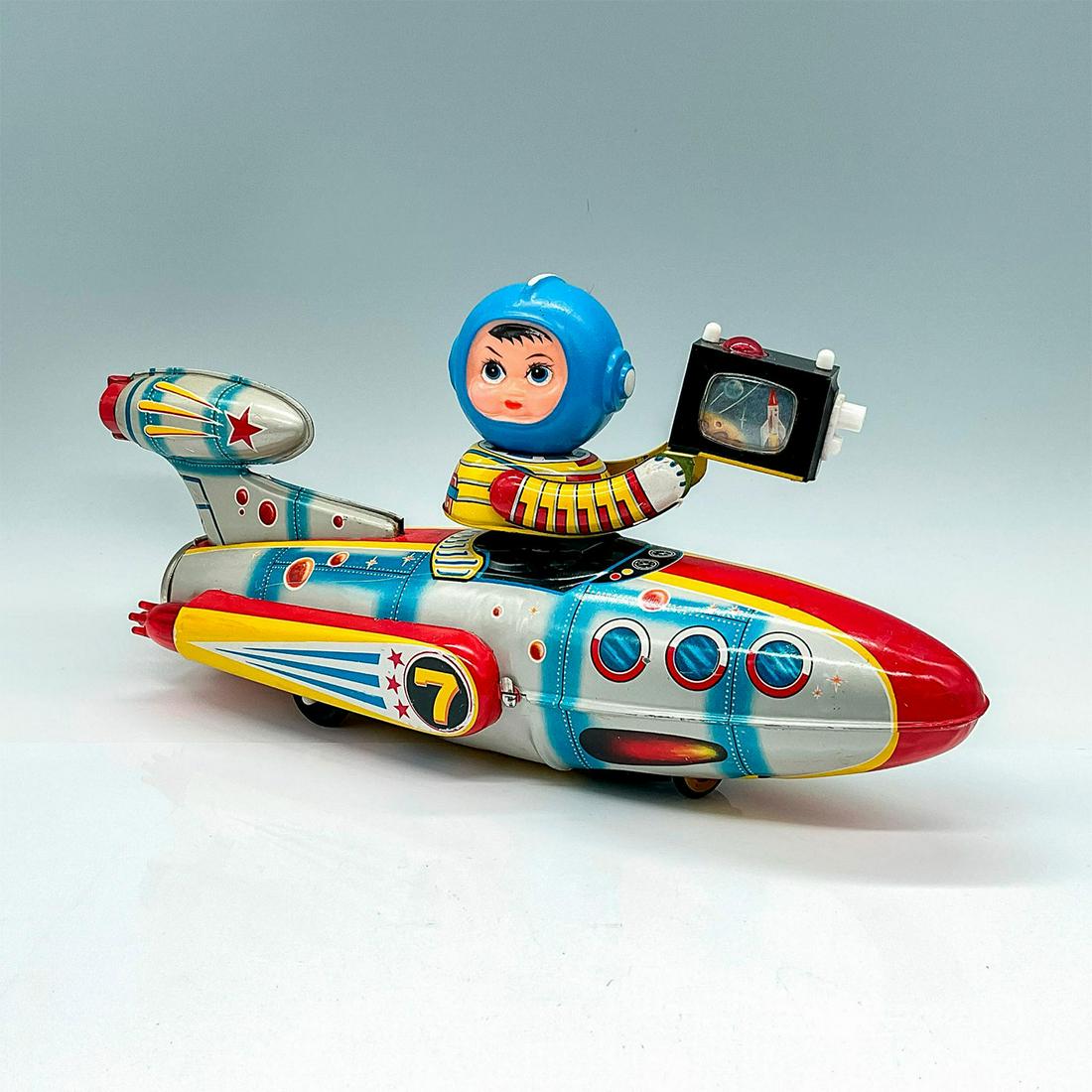 Universe Televiboat ME777 Battery Operated Space Toy: A clean tin-litho toy with rubber headed astronaut. All original with Astronaut Driver with TV Camera. This item has its original box with measurements 14.5"L x 4.5"W x 7"H. Issued: c. 1980 Dimensions