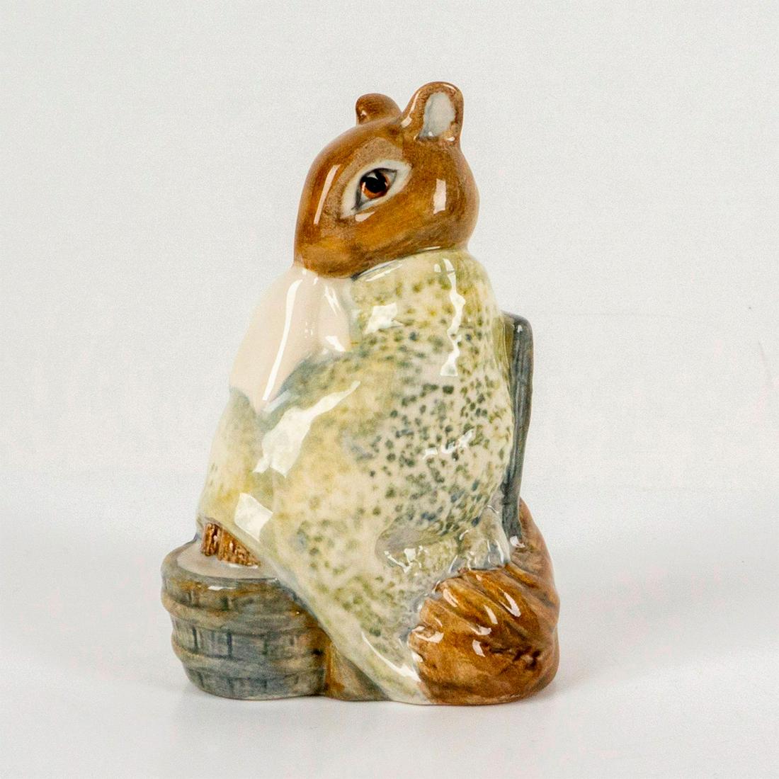 Chippy Hackee - Beswick - Beatrix Potter Figurine: Depicts a squirrel having a foot bath while holding a handkerchief and wrapped in a pale green blanket. Beswick backstamp. Dimensions: 2.25"L x 1.75"W x 3.5"H Manufacturer: Beatrix Potter Country of O