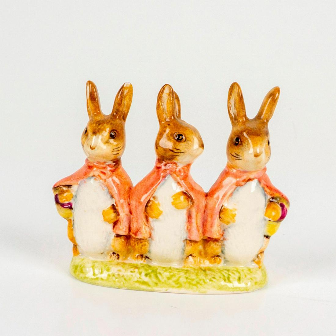 Flopsy Mopsy & Cottontail - Beswick - Beatrix Potter Figurine: Depicts a trio of identical bunnies dressed in white shirts with red hoods. Beswick backstamp. Dimensions: 2.75"L x 1.5"W x 2.5"H Manufacturer: Beatrix Potter Country of Origin: England