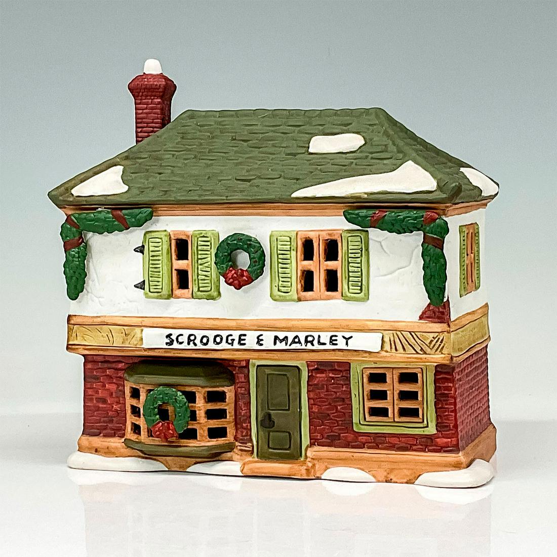 Department 56 Figure, Scrooge & Marley Counting House: Part of the Dickens Village Series. Hand painted porcelain, depicting the neglected and dilapidated office of Ebenezer Scrooge. This item has its original box with dimensions: 6.5"L x 4.25"W x 6.5"H. 