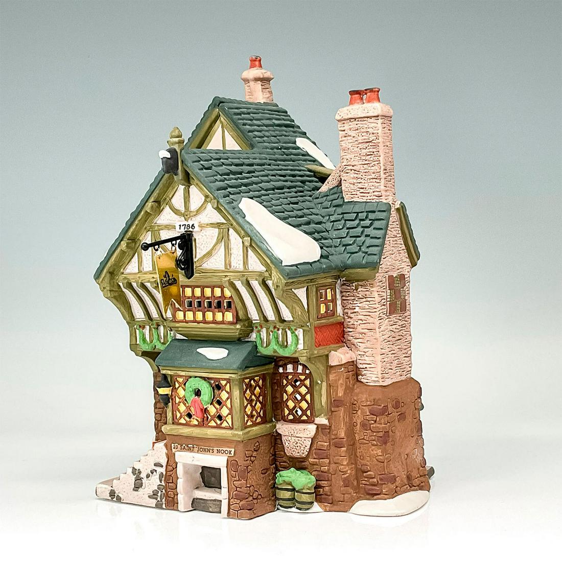 Department 56 Figure, The Pied Bull Inn: Part of the Dickens' Village Series. Second edition in a limited series limited to 1993. Hand-painted porcelain figure modeled as an old English style inn with snow laden eaves and Christmas wreaths d