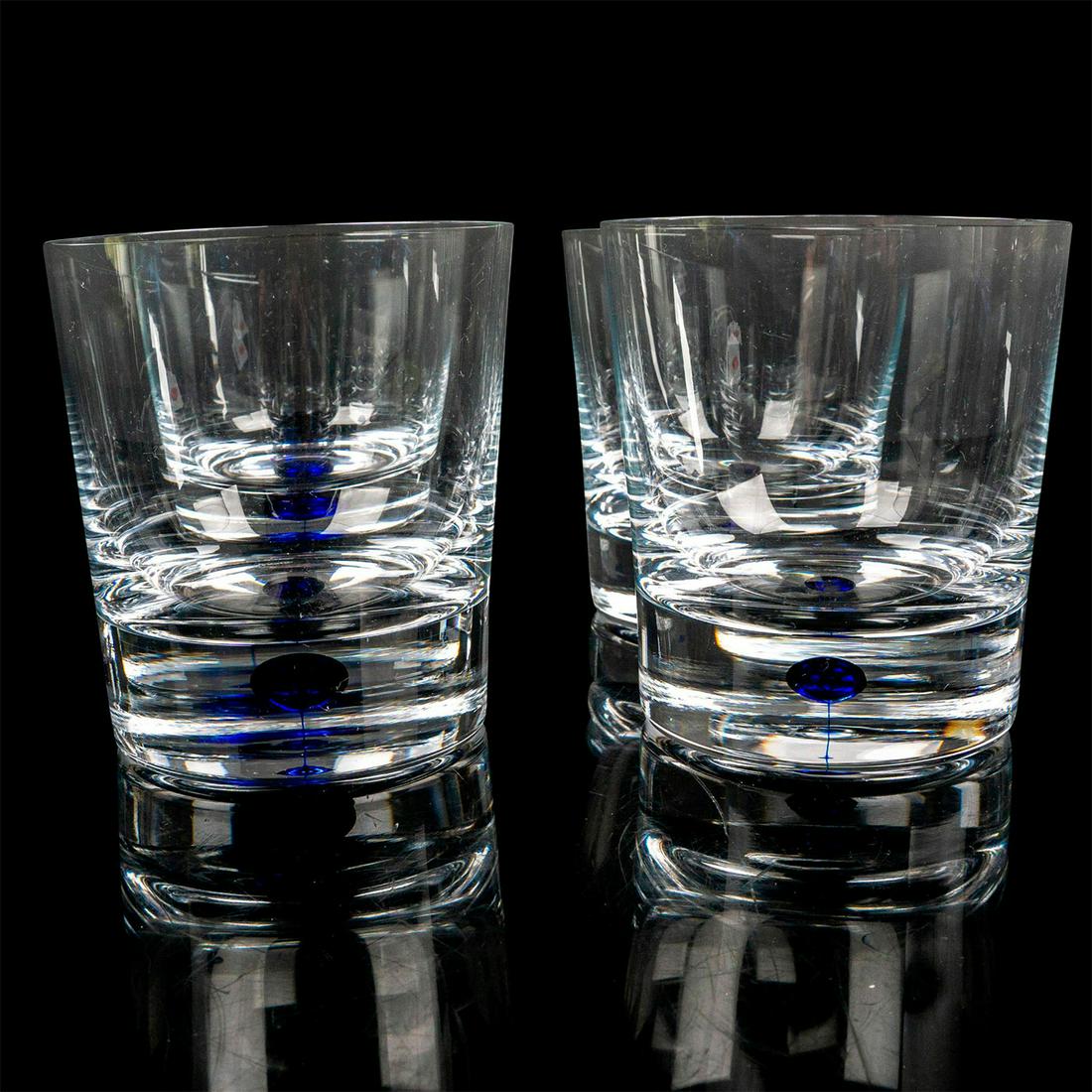 4pc Orrefors Double Old Fashion Glasses, Intermezzo Blue: Clear blown glass cups decorated with the blue drop in the stem. Orrefors etched backstamp. Artist: Erika Lagerbielke Dimensions: 3.5"W x 4"H Manufacturer: Orrefors Country of Origin: Sweden