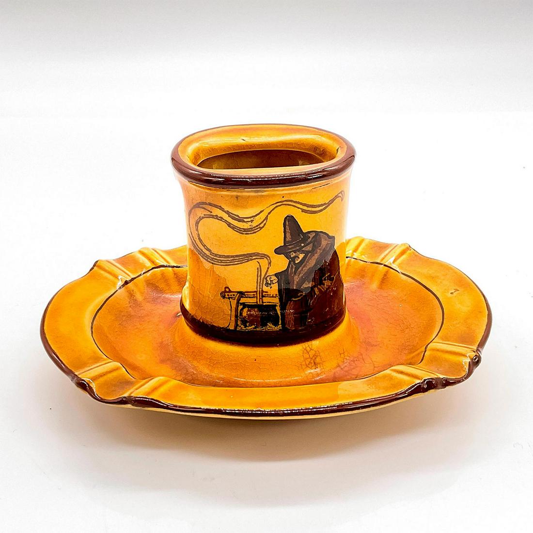 Royal Doulton Ashtray With Match Holder, Witches: Series Ware ashtray depicting witches and brewing cauldrons. Royal Doulton backstamp, D2735. Issued: c. 1906 Dimensions: 6.5"L x 4.75"W x 3.5"H Manufacturer: Royal Doulton Country of Origin: England